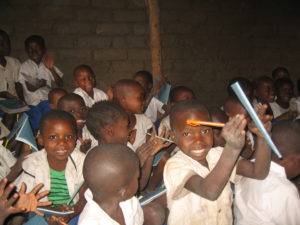 Children are happy to receive their new School Supplies provided by Flamme d’Avenir at Katanga Primary School in October 2015